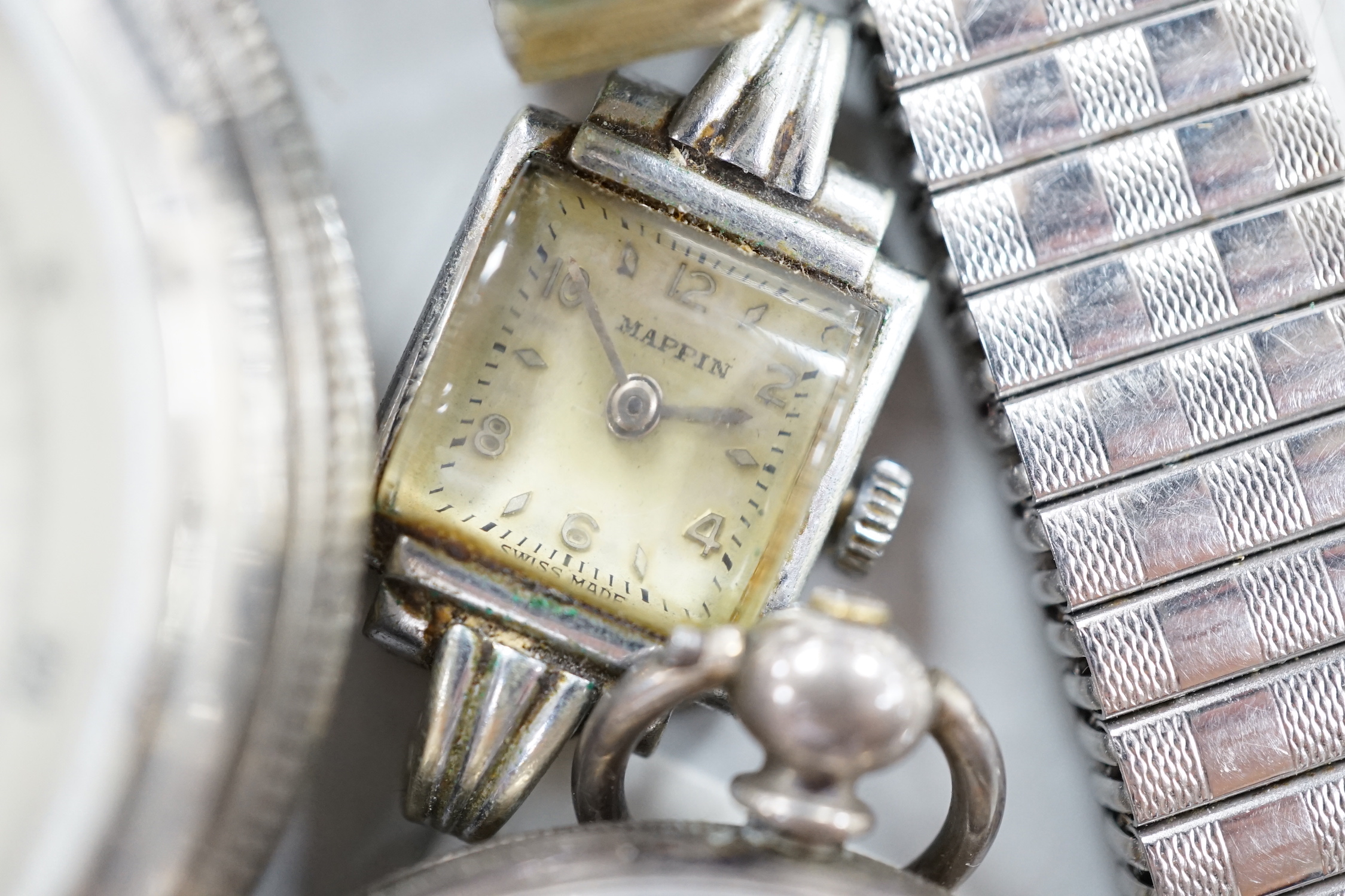 Twenty one assorted silver or base metal pocket watches including Waltham and Child of Birmingham, three wrist watches and a silver vesta case.